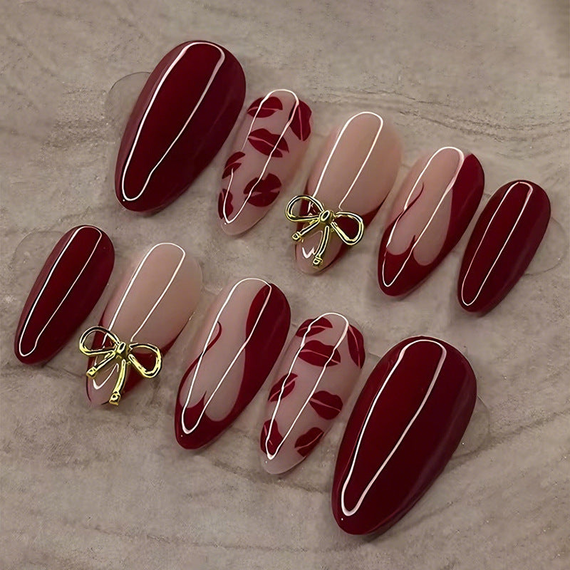 Kunstnagelset mit eleganten Schleifen- und Kussmund-Designs Karnz
