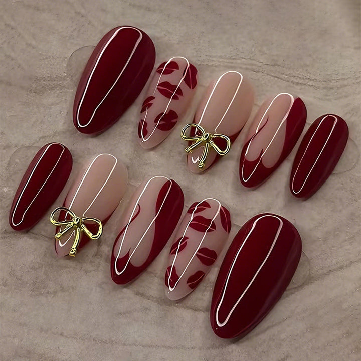 Kunstnagelset mit eleganten Schleifen- und Kussmund-Designs Karnz