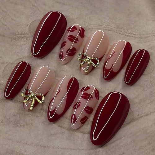 Kunstnagelset mit eleganten Schleifen- und Kussmund-Designs Karnz