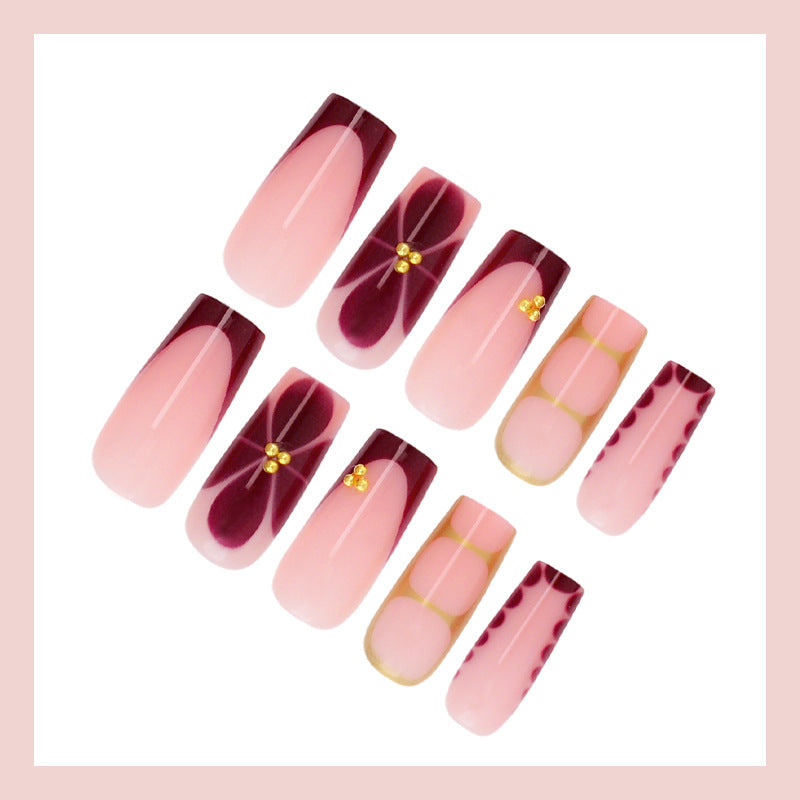 Kunstnagelset mit eleganten Farbverlauf und filigranen Verzierungen Karnz