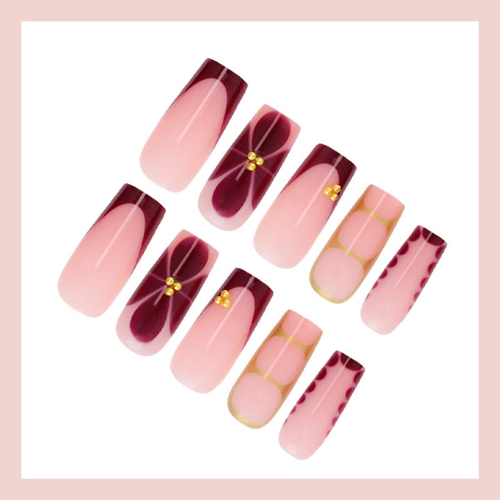Kunstnagelset mit eleganten Farbverlauf und filigranen Verzierungen Karnz