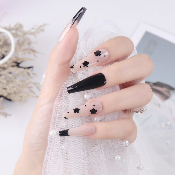Dekorative schwarze florale Stiletto Press-On Nägel Karnz