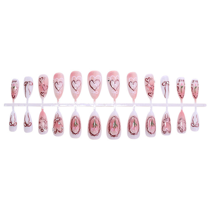 Kunstnagelset mit romantischen Herzen und Schleifen-Design Karnz