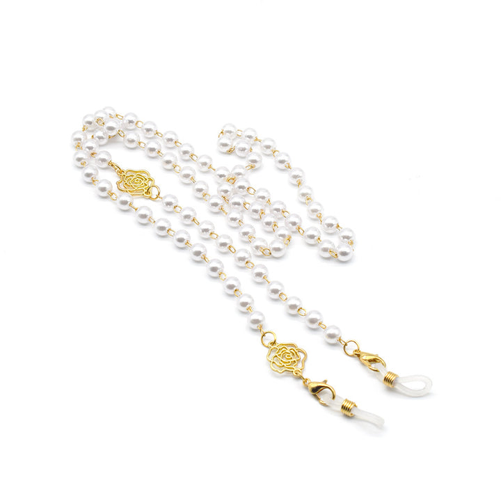 Elegante Brillekette mit Perlen und Goldakzenten Karnz