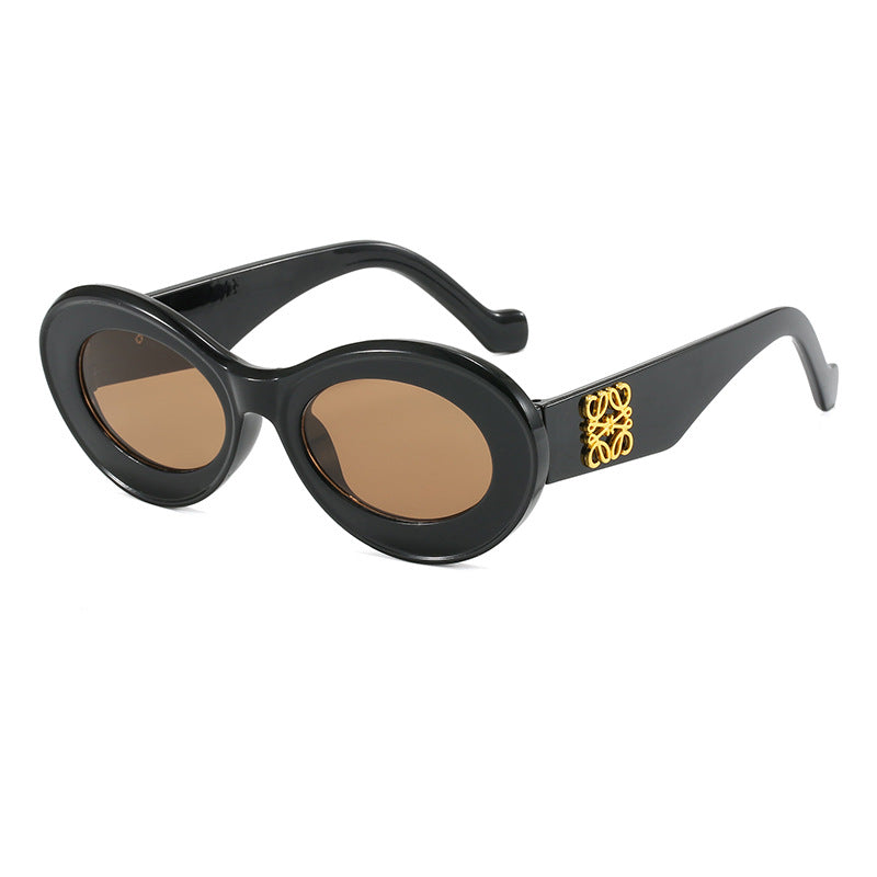 Damen modische Sonnenbrille mit ovalem Rahmen und goldenen Applikationen Karnz