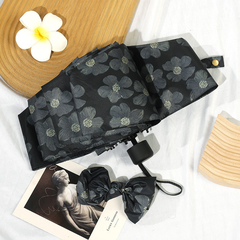 Damen Mini Faltregenschirm mit elegantem Blumendruck Karnz