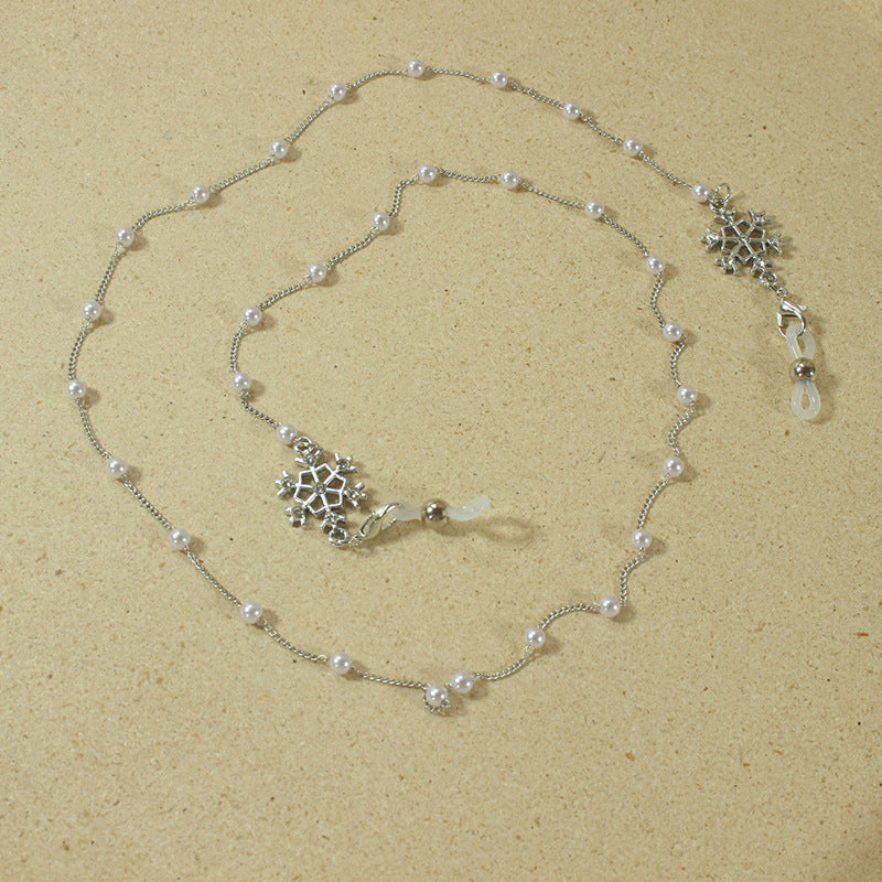 Elegante Brillenhalterkette mit Perlen und Schneeflockenanhänger Karnz