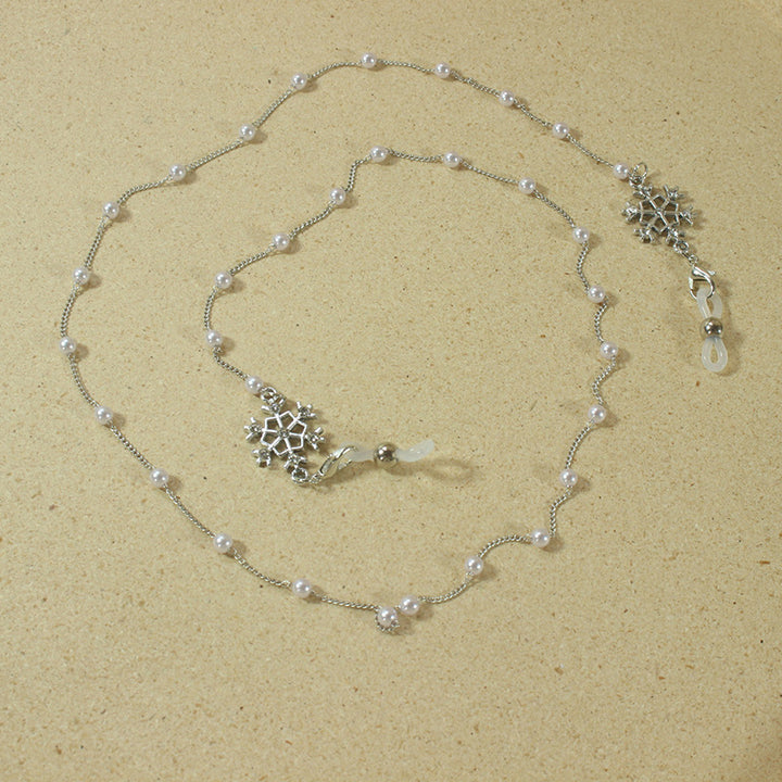 Elegante Brillenhalterkette mit Perlen und Schneeflockenanhänger Karnz