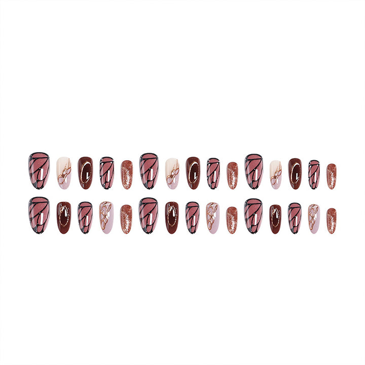 Kunstnagelset mit elegantem Gold- und Schwarzdesign Karnz