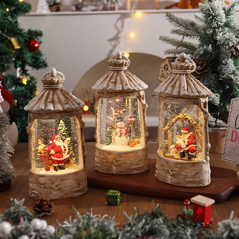 Beleuchtete Weihnachtslaterne mit Schneeszenen Karnz