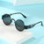 Damen künstlerische runde Sonnenbrille mit elegantem filigranen Rahmen Karnz
