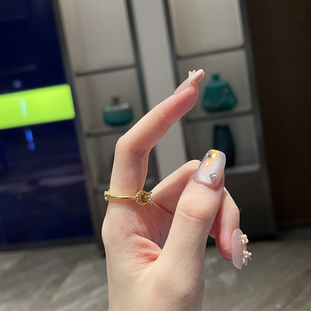 Dekorativer Press-on-Nagelkunst-Set mit künstlerischem Bogen und Perlenakzenten Karnz