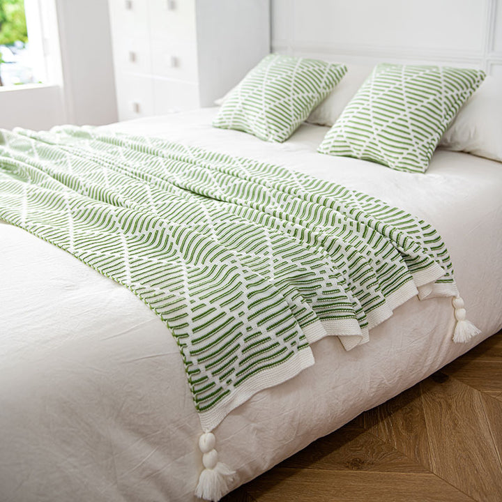 Dekorativer Strickwurfdecke