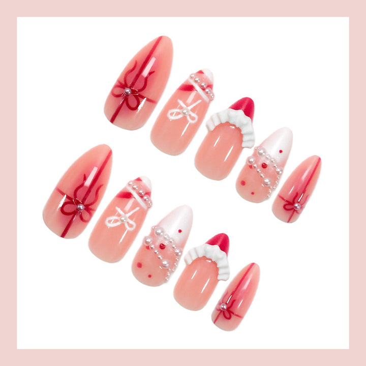 Kunstnagelset mit glamourösen Schleifen und eleganten Perlenverzierungen Karnz