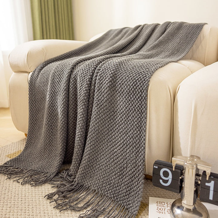 Strukturierte Strickwurfdecke