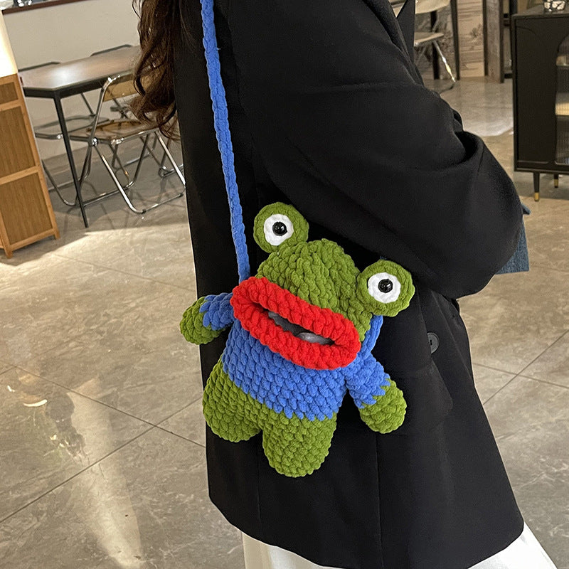 Süßer froschförmiger gehäkelter Mini-Rucksack