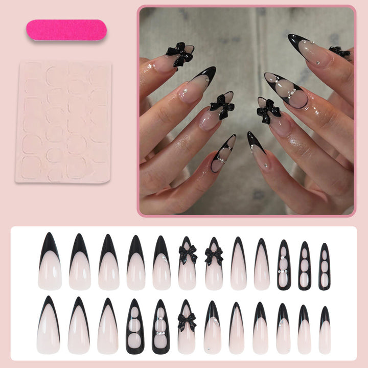 Kunstnagelset mit schimmernden Akzenten und eleganten Schleifen Karnz