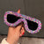 Damen trendige Sonnenbrille mit kreativem Zuckerguss-Design Karnz