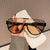 Damen Sportliche Schutzbrille mit futuristischem Design Karnz