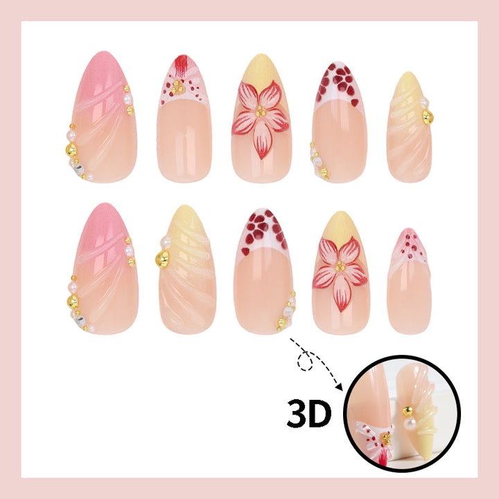 Kunstnagelset mit kreativen floralem Design und glitzernden Akzenten Karnz