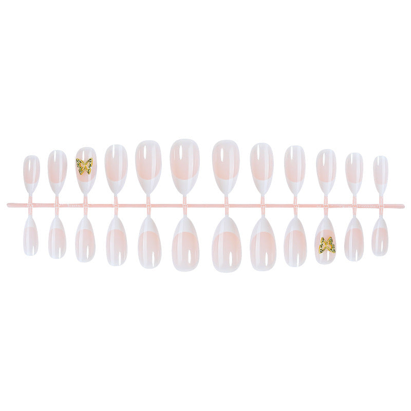 Modisches Press-On-Nagelset mit eleganten French Tips und dekorativen Akzenten Karnz