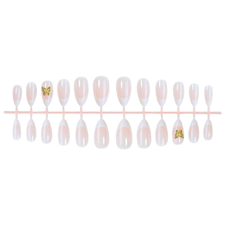 Modisches Press-On-Nagelset mit eleganten French Tips und dekorativen Akzenten Karnz
