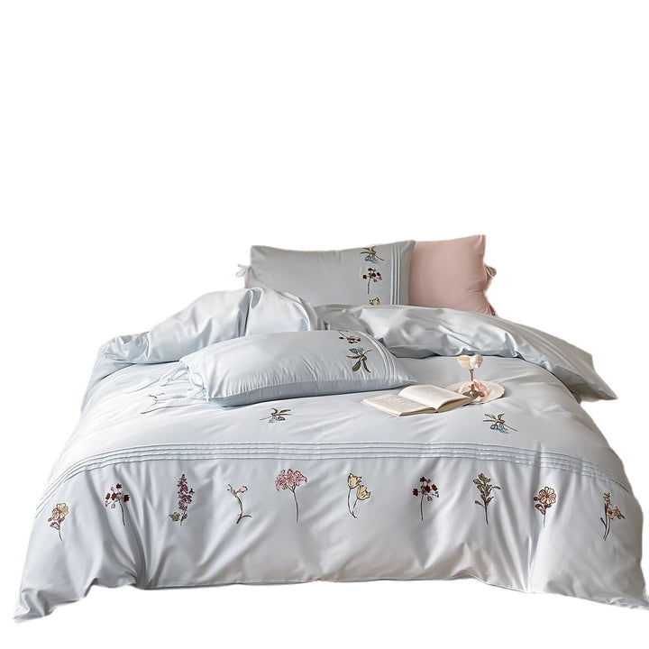 Elegante Bettwäsche-Garnitur mit feiner Blumenstickerei, Volantkissen und Wendefunktion