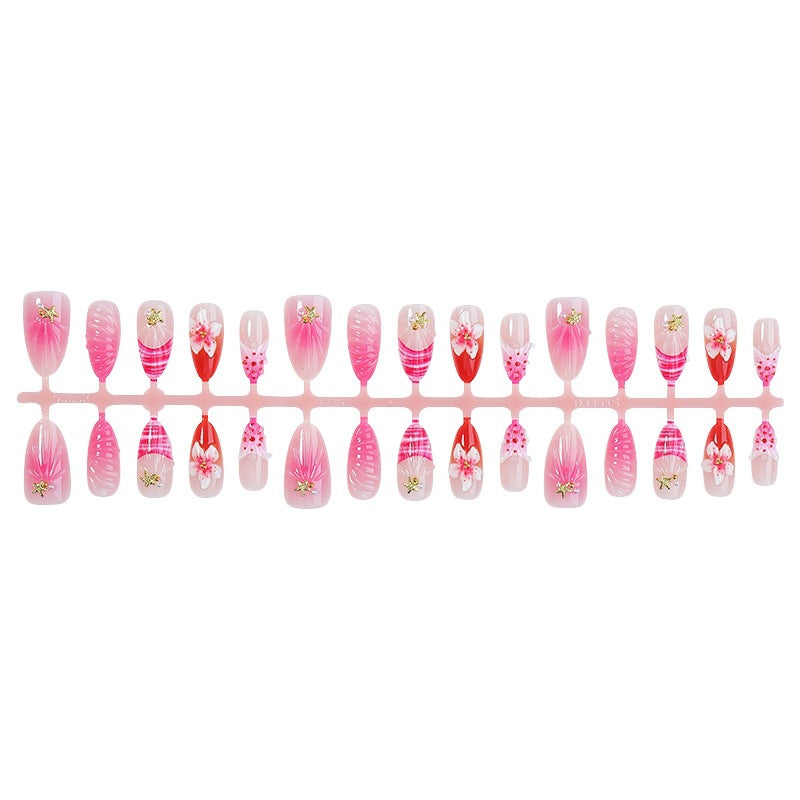 Kunstnagelset mit blühenden 3D-Details und Glitzerakzenten Karnz