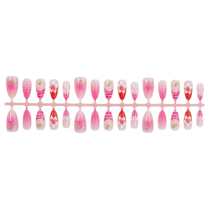Kunstnagelset mit blühenden 3D-Details und Glitzerakzenten Karnz