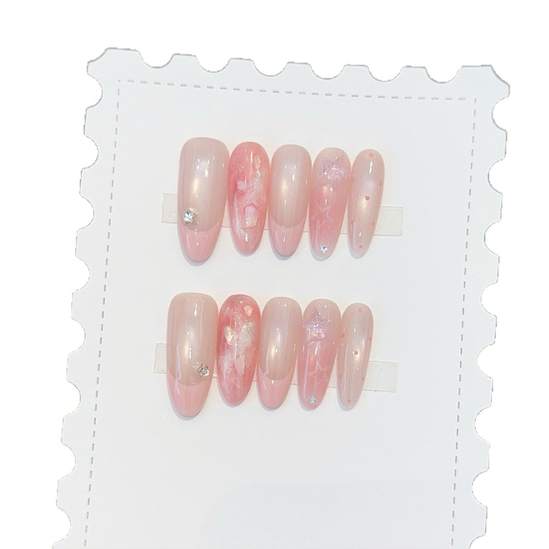 Kunstnägel mit Zartem Glitzer und Sternenmotiven Karnz