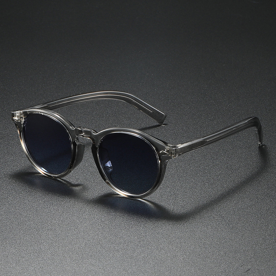 Damen Rund-Sonnenbrille mit transparentem Rahmen und reflektierenden Gläsern Karnz