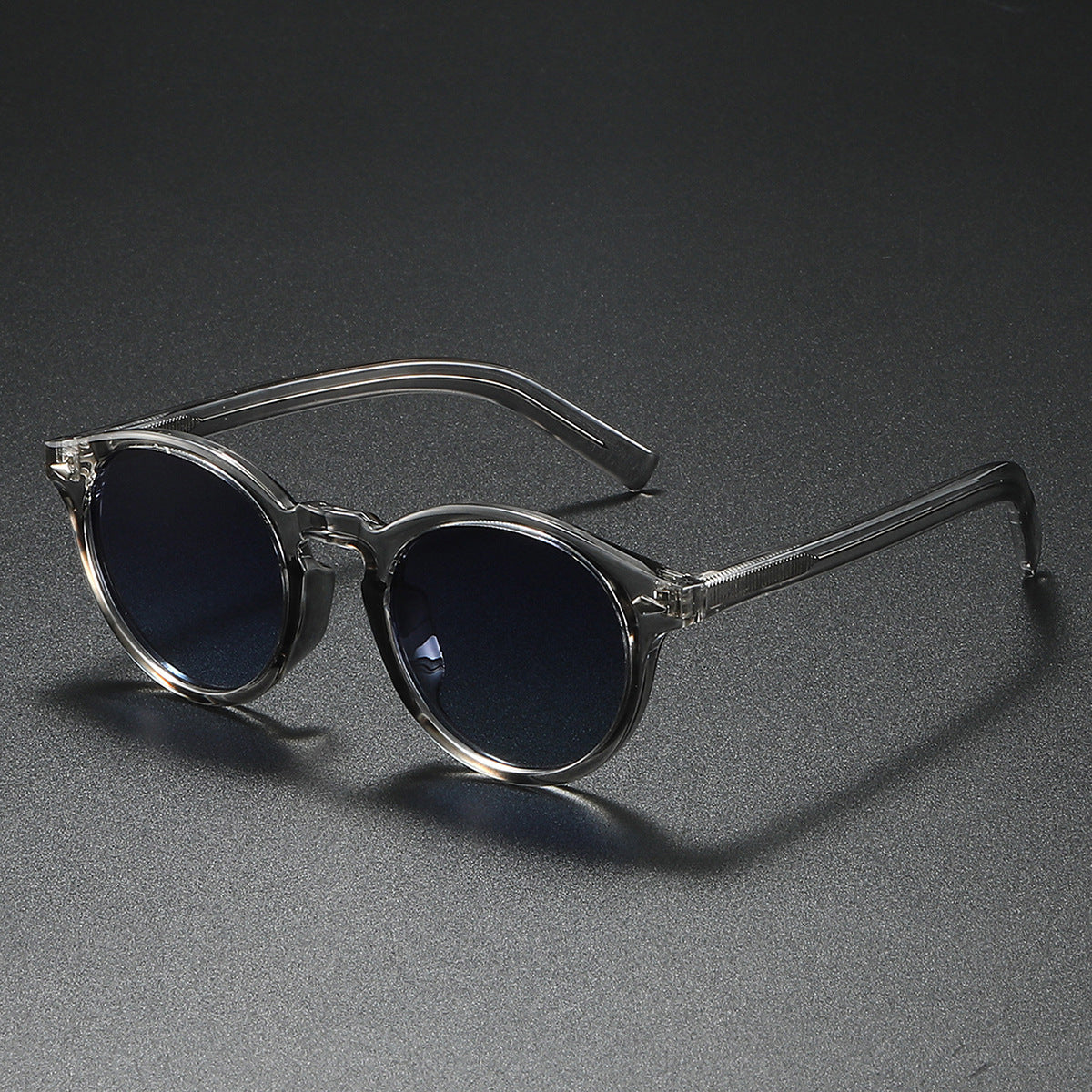 Damen Rund-Sonnenbrille mit transparentem Rahmen und reflektierenden Gläsern Karnz