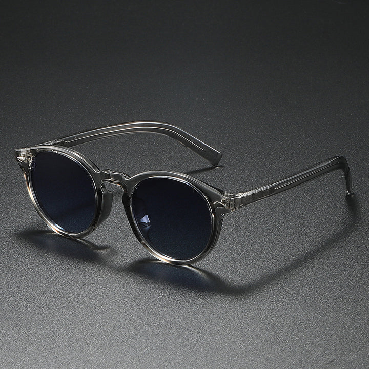 Damen Rund-Sonnenbrille mit transparentem Rahmen und reflektierenden Gläsern Karnz