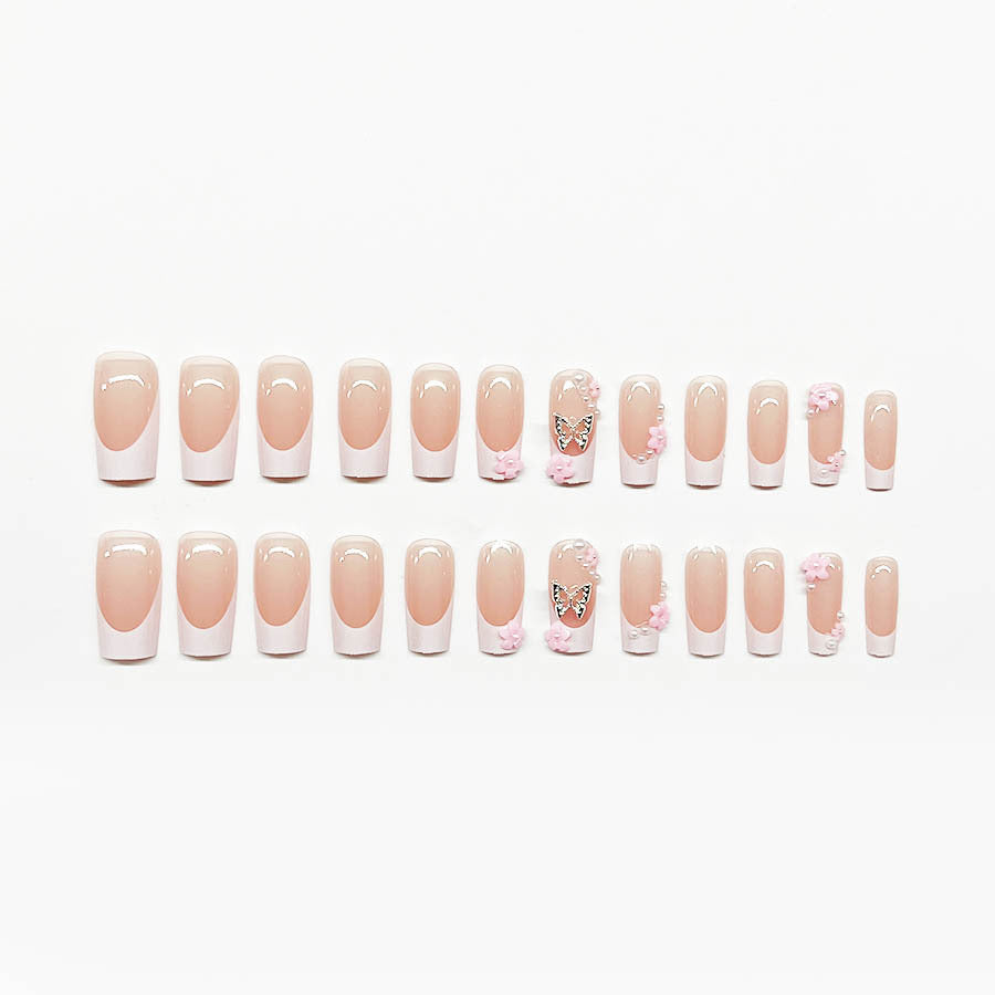 Kunstnagelset mit verspielten 3D-Blüten und Glitzerakzenten Karnz