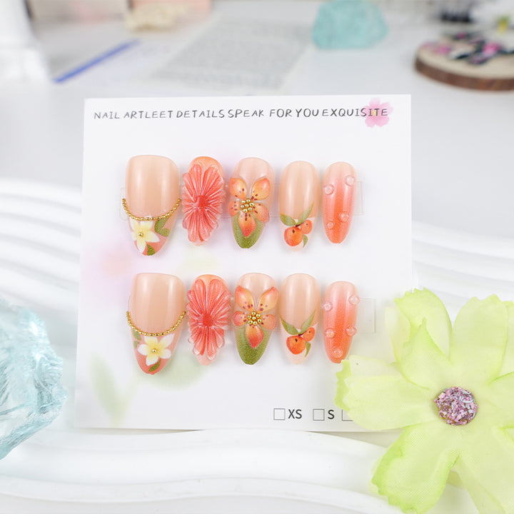 Kunstnagelset mit romantischen Blüten und fruchtigen Akzenten Karnz