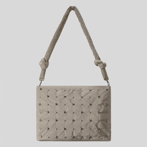 Dekorativer gesteppter Handtasche