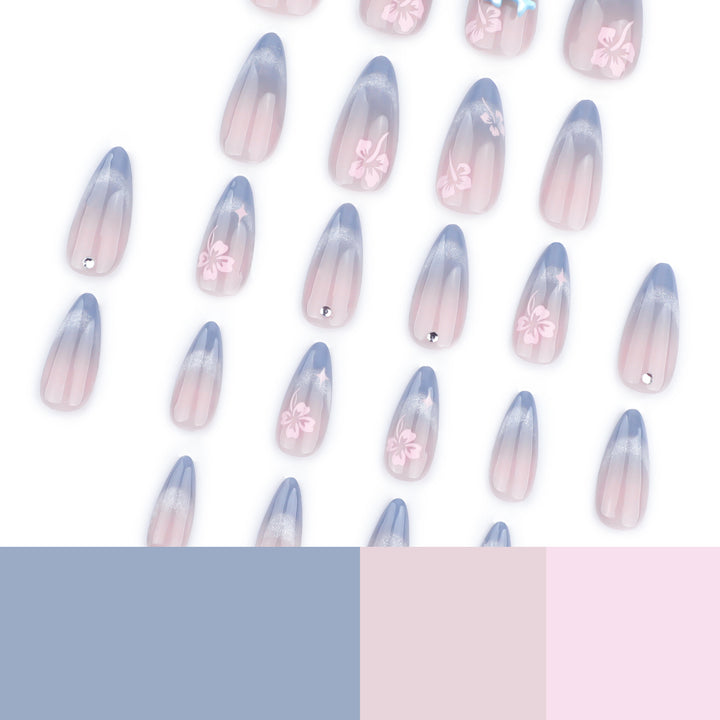 Kunstvolle Nagelverlängerungen mit elegantem Ombré-Design und floralen Akzenten Karnz