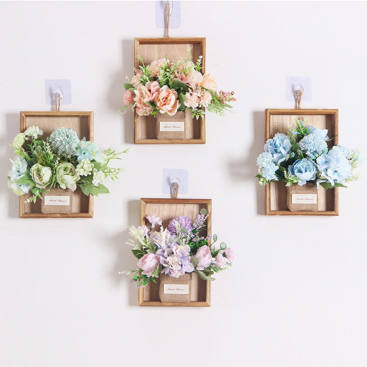 Wandmontierte dekorative florale hängende Pflanzgefäß