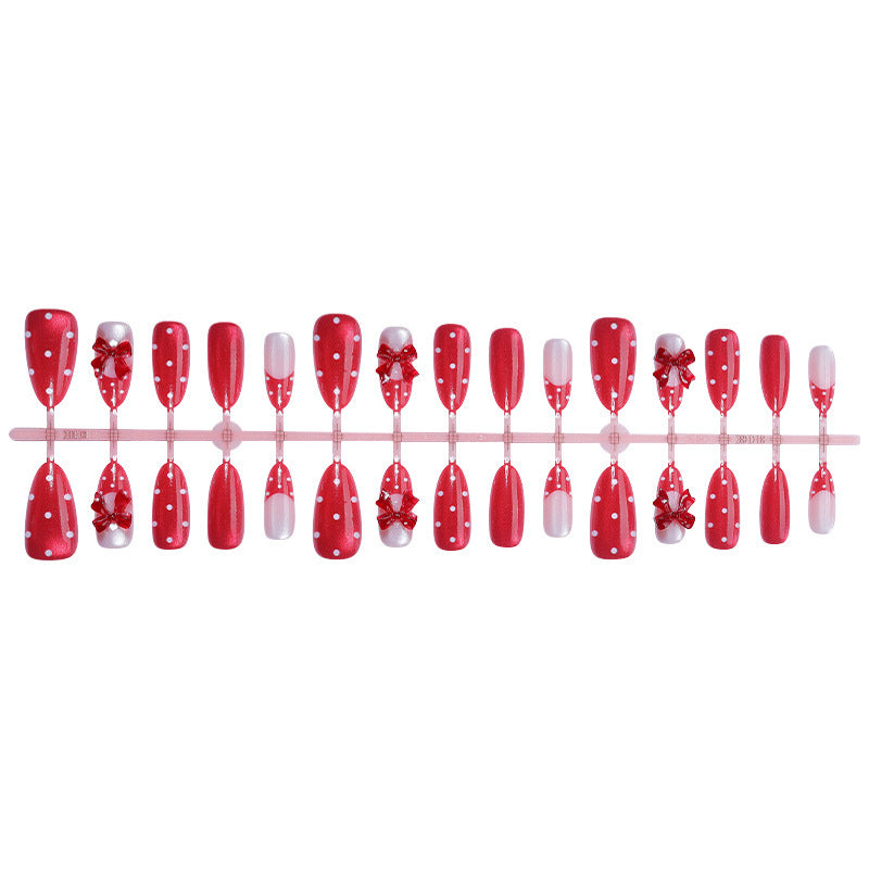 Charmantes dekoratives Press-On Nagelkunstset mit Schleifen- und Punkten-Design Karnz