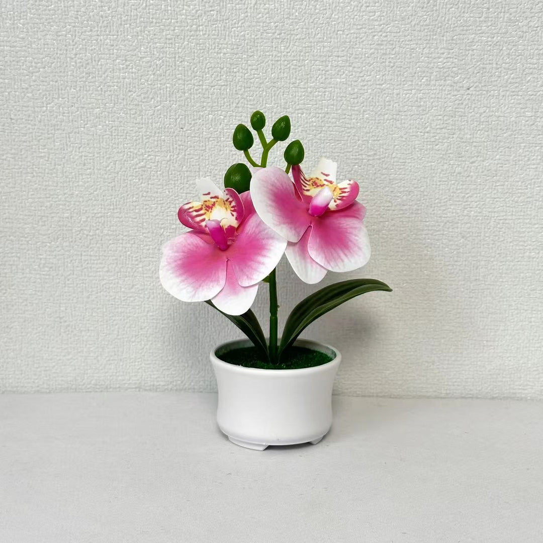 Elegante künstliche Orchideenpflanzenanordnung für die Innendekoration