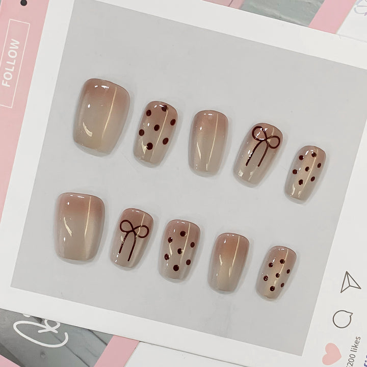 Künstliche Nagelspitzen mit Schleifen- und Punktmotiven Karnz