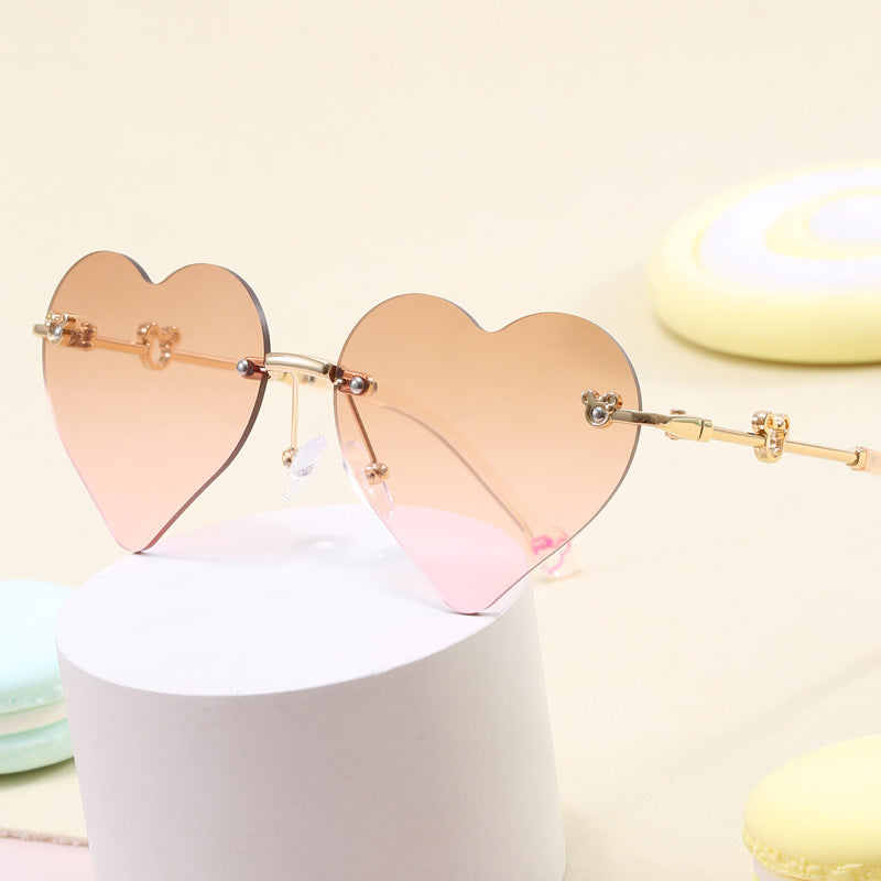 Damen Herzförmige Sonnenbrille mit verspiegelten Gläsern Karnz