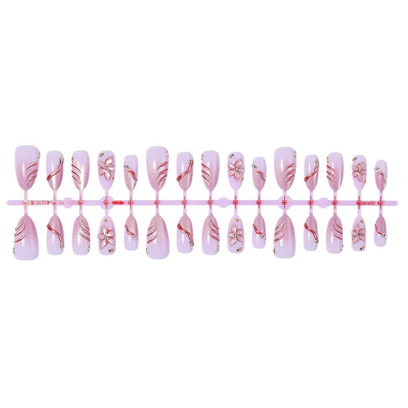 Kunstnagelset mit eleganten Blüten- und Glitzermotiven Karnz