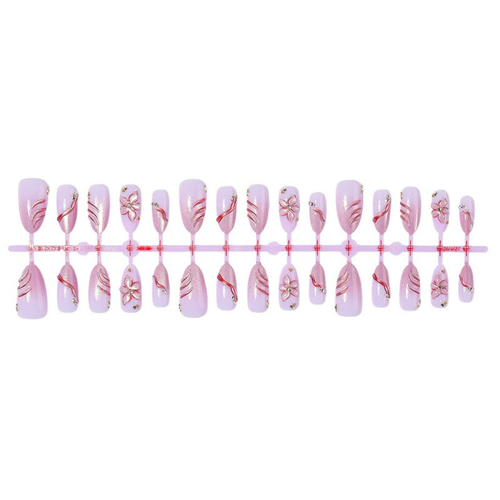 Kunstnagelset mit eleganten Blüten- und Glitzermotiven Karnz