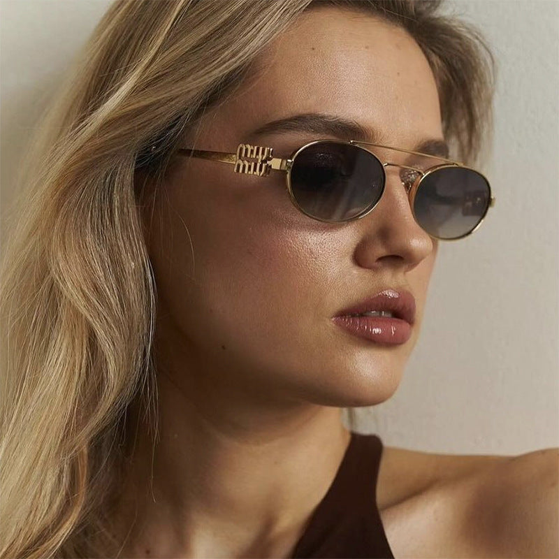 Damen elegante ovale Sonnenbrille mit luxuriösem Metallrahmen Karnz