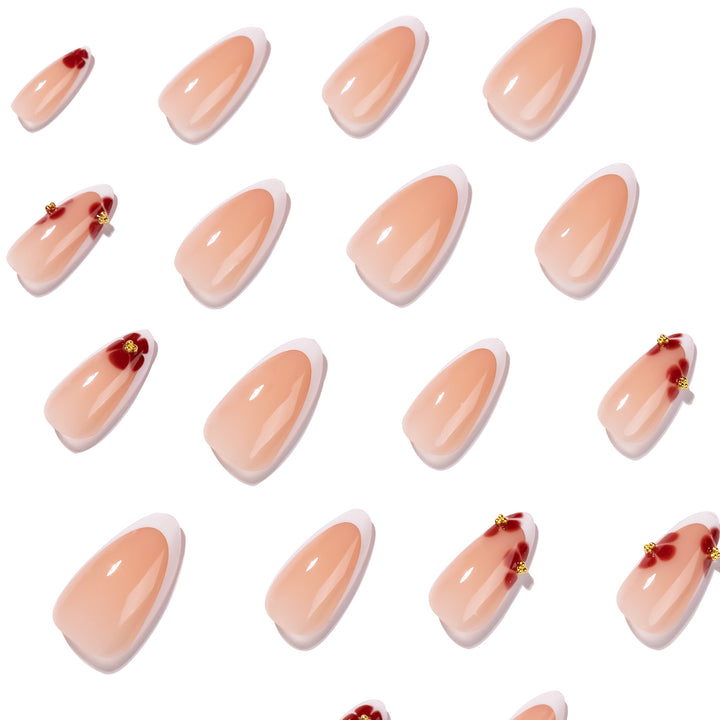 Kunstvolle Stiletto-Nägel mit luxuriösem floralem Design Karnz