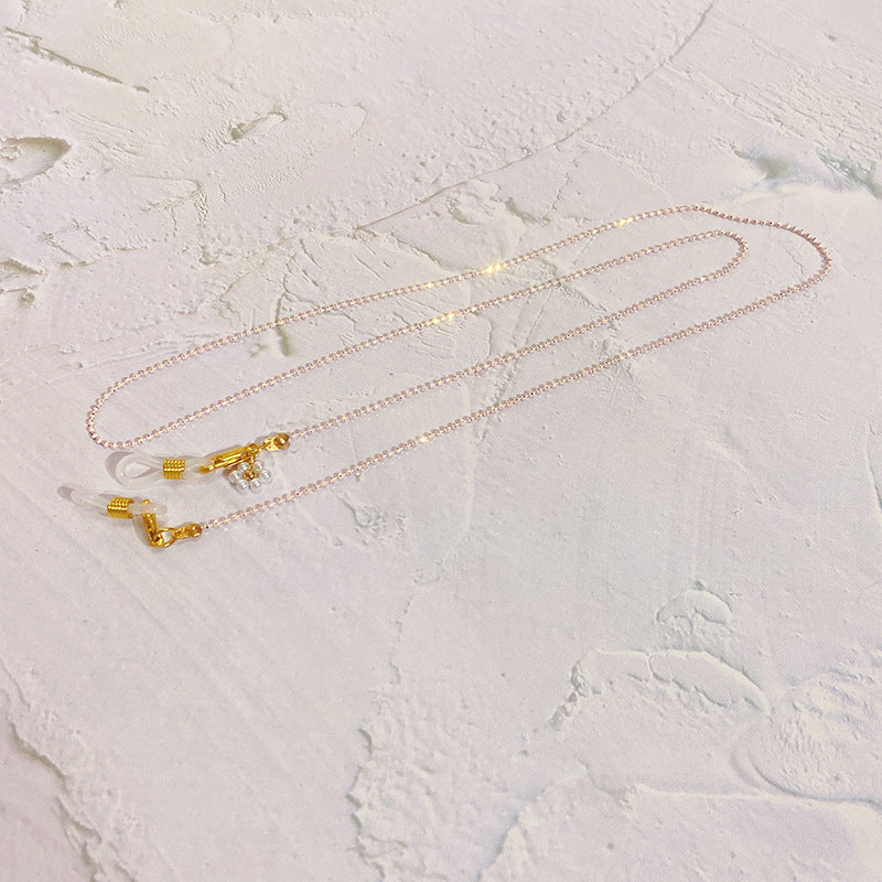 Kettenbrillenband mit Perlen und Goldanhängern Karnz