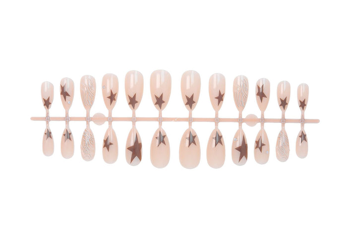 Kunstnagelset mit eleganten Sternenmotiven und Glitzerakzenten Karnz