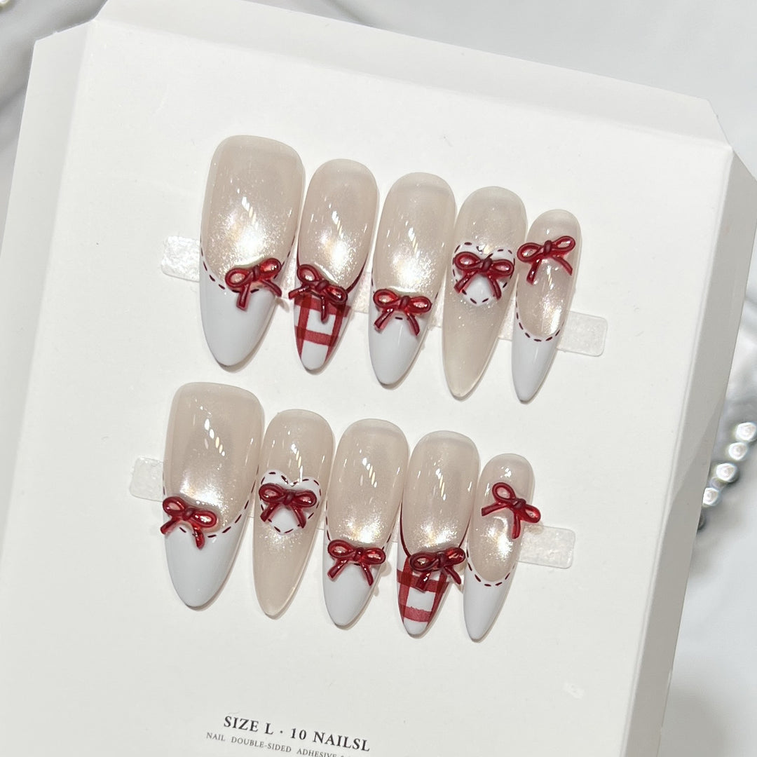 Dekorativer Stiletto Press-On Nagelset mit Schleifenakzenten Karnz