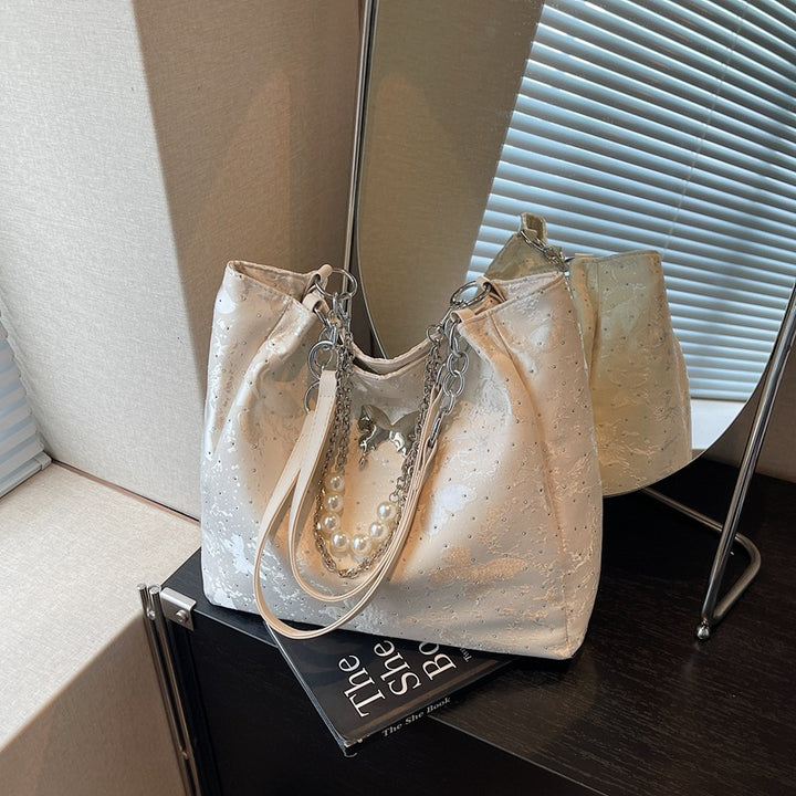 Elegante Handtasche mit Perlendetails Karnz